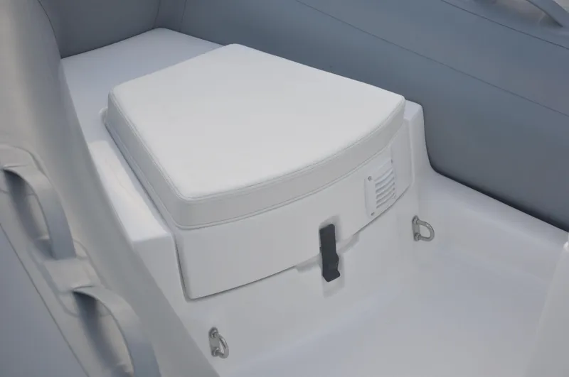 Slide: The Image of 2024 AB 11 VSX boat seat with white cushion and storage compartment. - 3