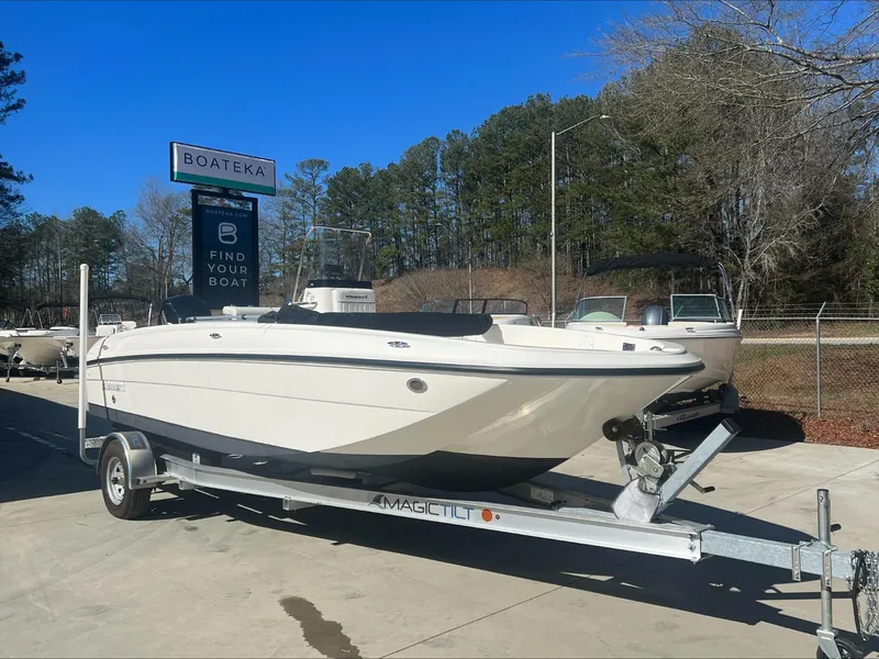Slide: The Image of 2021 Bayliner E21 boat on a trailer at Boateka dealership. - 2