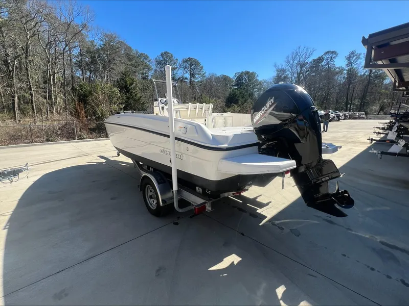 Slide: The Image of 2021 Bayliner E21 boat on a trailer with Mercury outboard motor. - 3