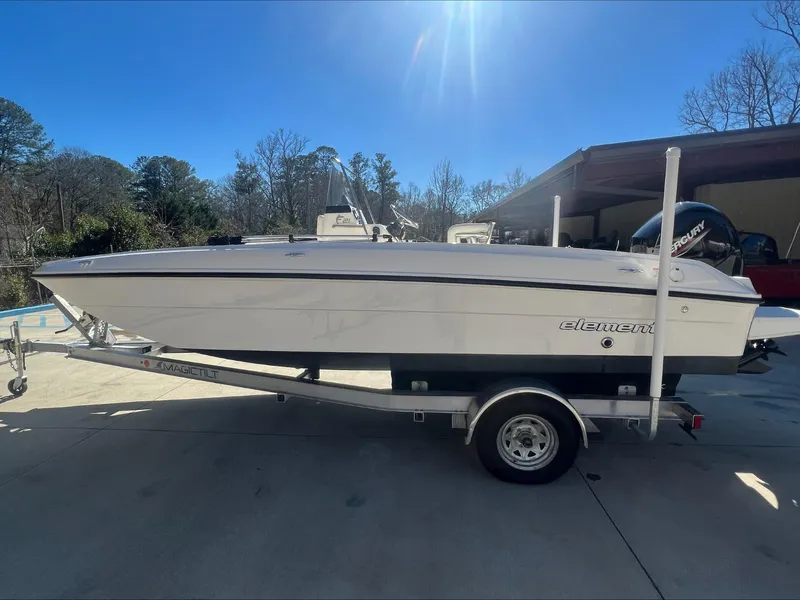Slide: The Image of 2021 Bayliner E21 boat on trailer in outdoor setting. - 4