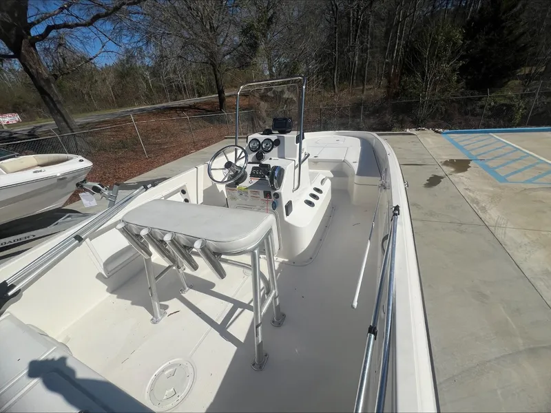 Slide: The Image of 2021 Bayliner E21 boat interior with steering console and seating. - 5