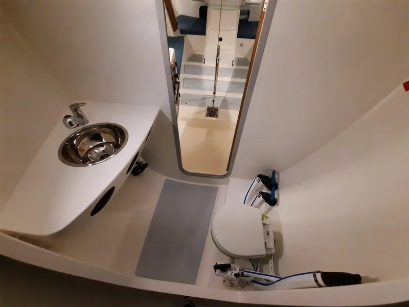 Slide: The Image of Compact bathroom in 2024 M.A.T. 1070 yacht with sink and toilet. - 11