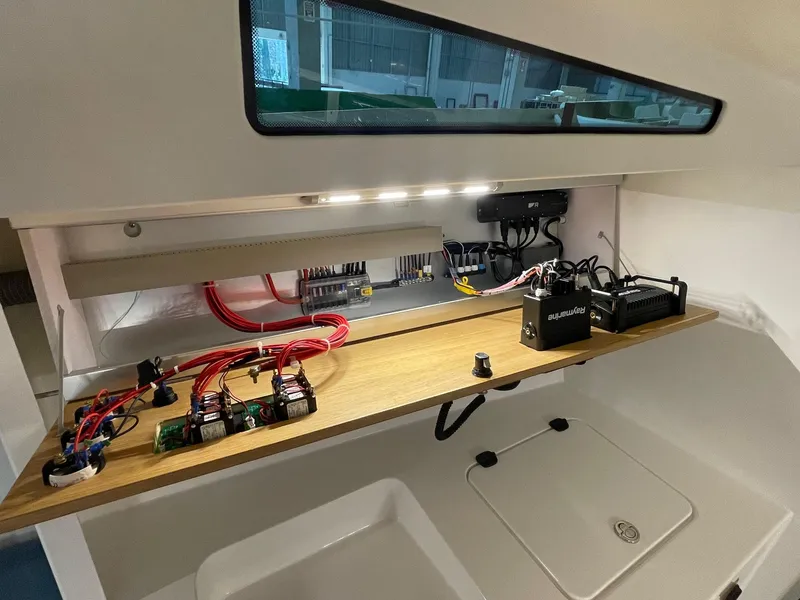 Slide: The Image of Electrical system setup in M.A.T. 1070, 2024 model, with wiring and components. - 14