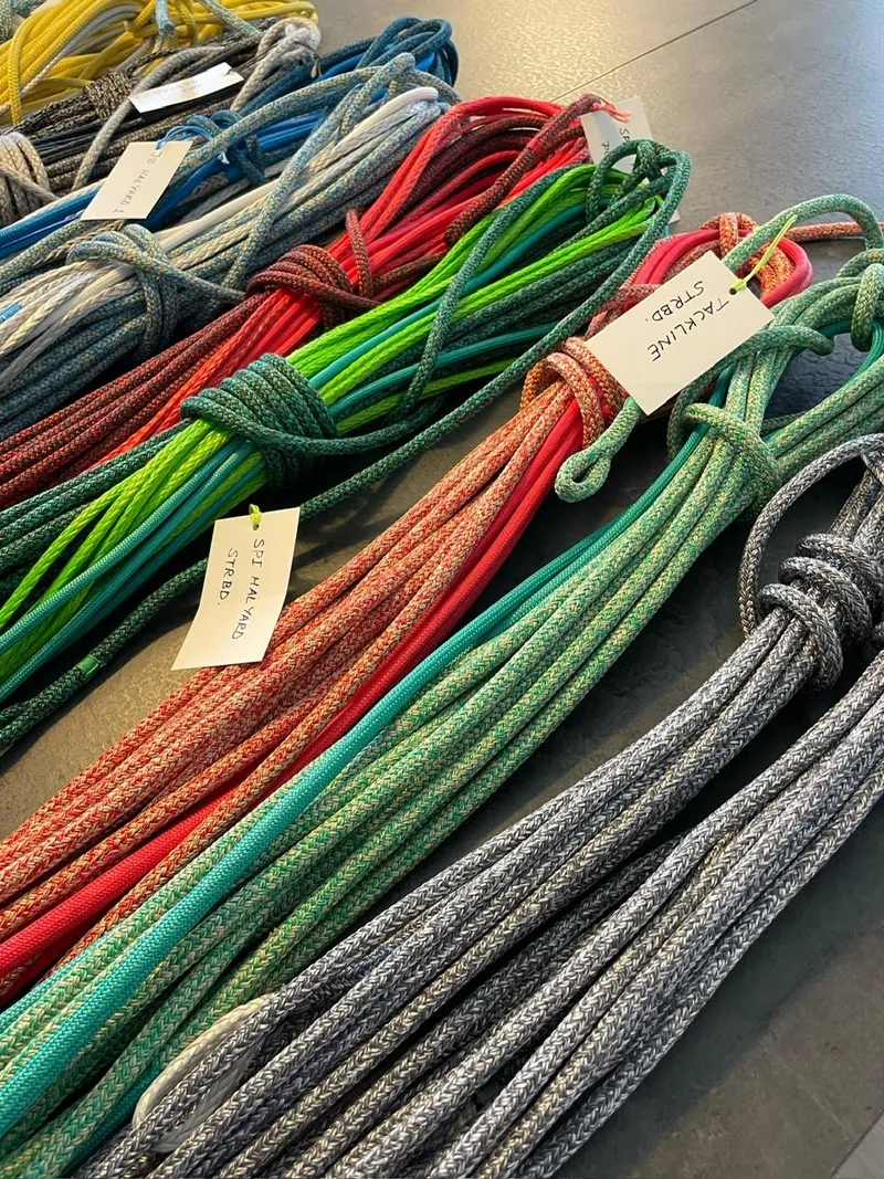 Slide: The Image of Colorful climbing ropes displayed on a table, labeled with tags. M.A.T. 1070, 2024 model. - 15