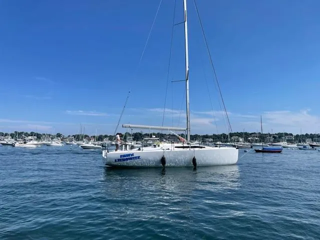 Slide: The Image of Sailboat M.A.T. 1070 2024 anchored in a marina on a sunny day. - 3