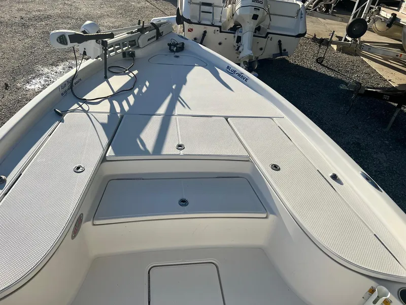 Slide: The Image of 2011 Blue Wave Pure Bay 2400 boat deck with storage compartments. - 10