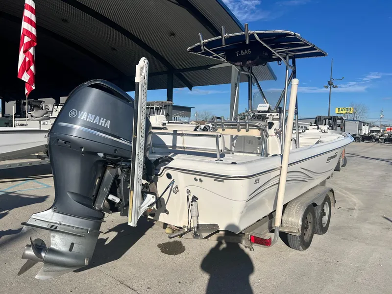 Slide: The Image of 2011 Blue Wave Pure Bay 2400 boat with Yamaha outboard motor on trailer. - 3