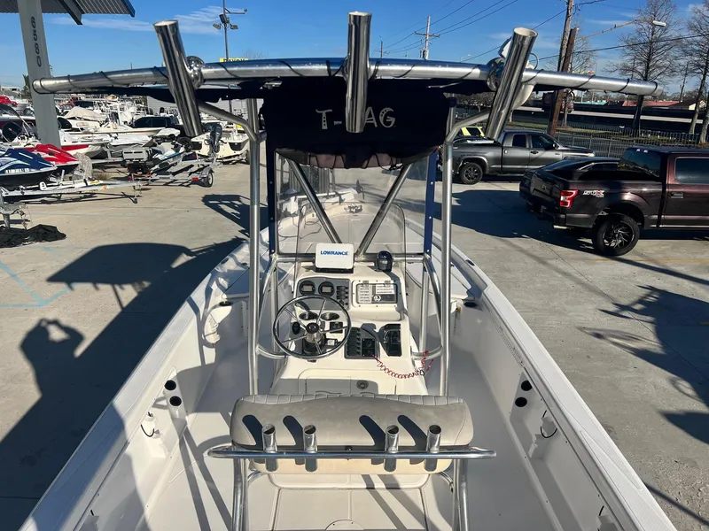 Slide: The Image of 2011 Blue Wave Pure Bay 2400 boat with center console and fishing rod holders. - 7