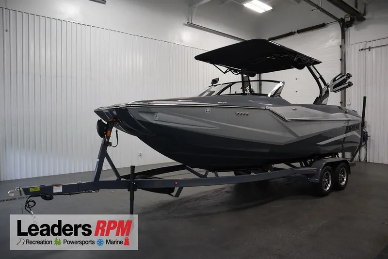 The Image of 2024 Supreme ZS232 boat on trailer in indoor showroom at Leaders RPM. - 1