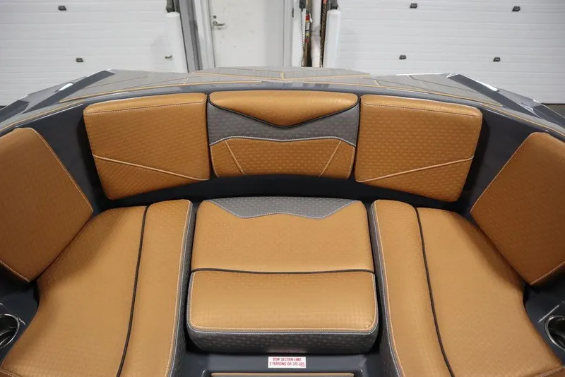 Slide: The Image of 2024 Supreme ZS232 boat interior with tan and black cushioned seating. - 11