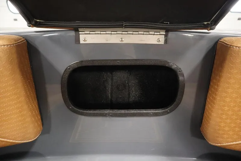 Slide: The Image of 2024 Supreme ZS232 storage compartment with open lid and brown cushioned sides. - 13