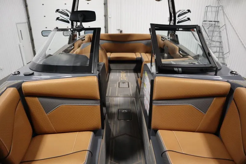 Slide: The Image of 2024 Supreme ZS232 boat interior with tan and gray seating. - 20