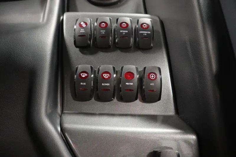 Slide: The Image of 2024 Supreme ZS232 boat control panel with illuminated switches. - 29