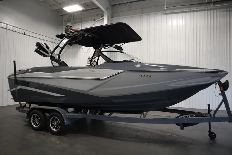 Slide: The Image of 2024 Supreme ZS232 boat on trailer in indoor storage. - 3