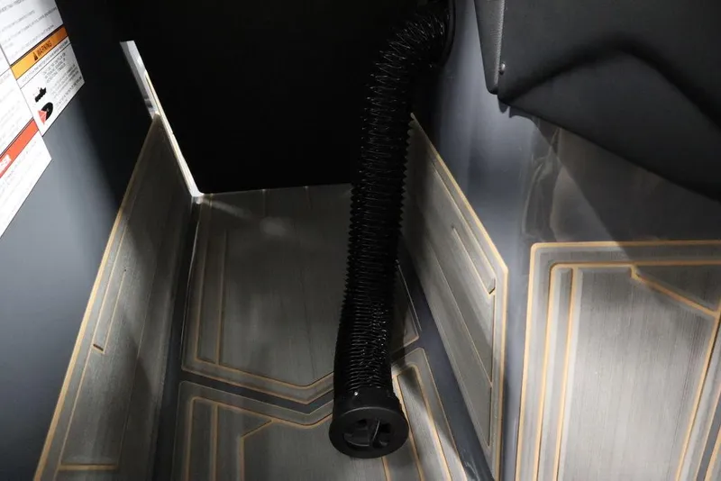 Slide: The Image of 2024 Supreme ZS232 boat interior with black hose and patterned flooring. - 35