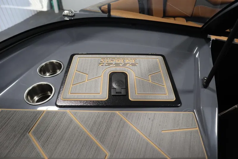 Slide: The Image of 2024 Supreme ZS232 boat interior with cup holders and storage compartment. - 41