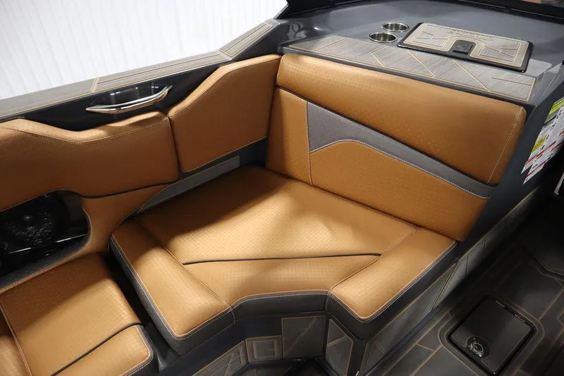 Slide: The Image of 2024 Supreme ZS232 boat interior with tan and gray seating. - 44