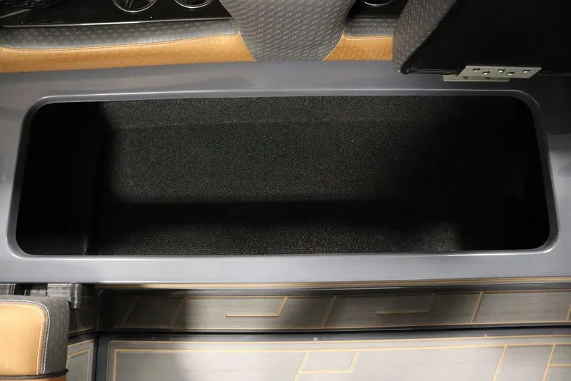 Slide: The Image of 2024 Supreme ZS232 boat storage compartment with black interior and sleek design. - 49