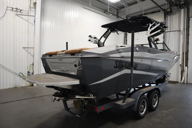 Slide: The Image of 2024 Supreme ZS232 boat on trailer in indoor storage facility. - 5