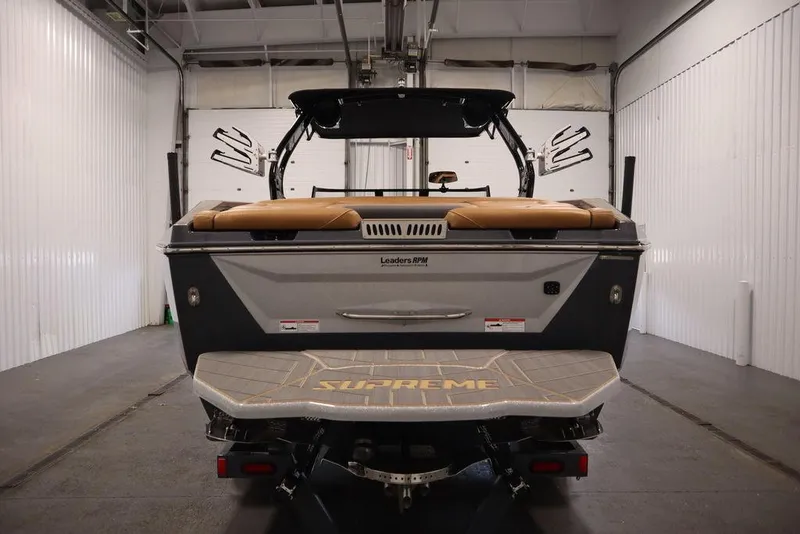 Slide: The Image of 2024 Supreme ZS232 boat rear view in a storage facility. - 6