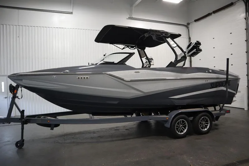 Slide: The Image of 2024 Supreme ZS232 boat on trailer in indoor showroom. - 8