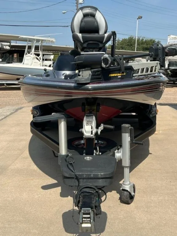 Slide: The Image of Dashboard of a 2014 Skeeter 20i boat with gauge and ignition key. - 13