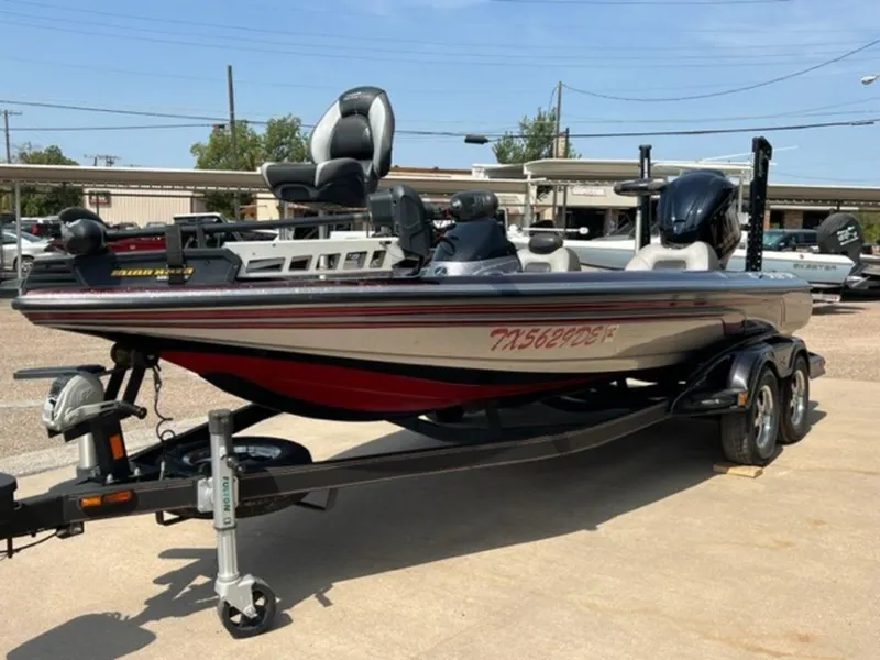 Slide: The Image of 2014 Skeeter 20i boat dashboard with steering wheel and instrument panel. - 14