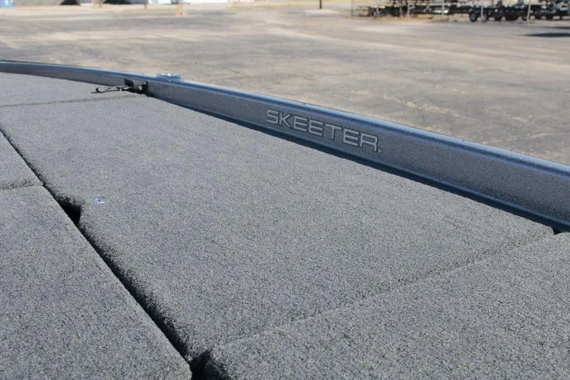Slide: The Image of 2014 Skeeter 20i boat deck with logo, featuring textured surface. - 19