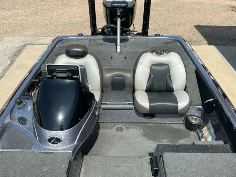 Slide: The Image of 2014 Skeeter 20i boat with powerful outboard motor in a parking lot. - 5