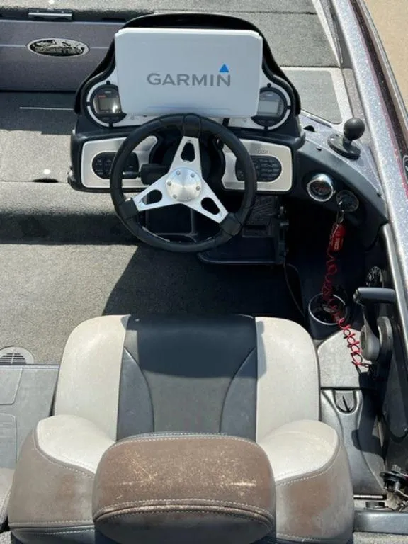 Slide: The Image of 2014 Skeeter 20i boat interior with carpeted deck and storage compartments. - 8