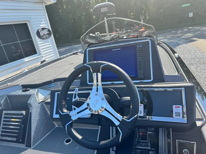 Slide: The Image of 2024 Ranger Z521R CUP boat dashboard with steering wheel and navigation screen. - 5