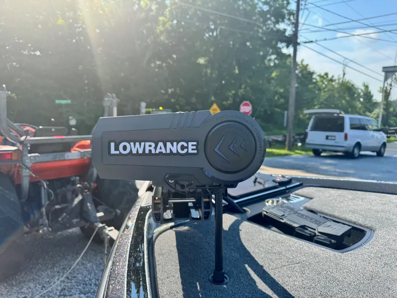 Slide: The Image of Lowrance fishfinder on 2024 Ranger Z521R CUP boat, outdoor setting. - 8