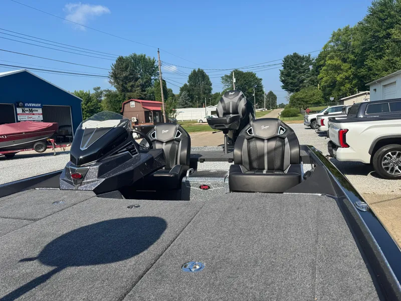 Slide: The Image of 2024 Ranger Z521R CUP boat interior with dual seats and control console. - 9