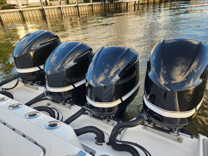 Slide: The Image of Four powerful outboard motors on a 2019 HCB 39 Speciale boat. - 13