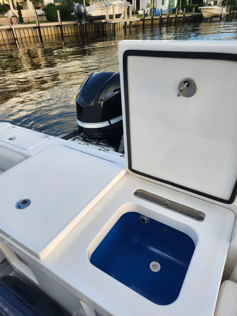 Slide: The Image of 2019 HCB 39 Speciale boat with open storage compartment by the water. - 14