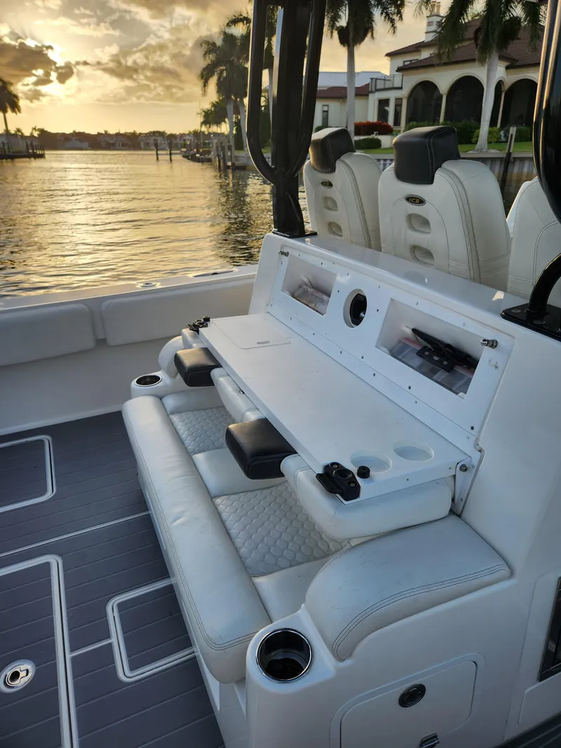Slide: The Image of 2019 HCB 39 Speciale boat interior with luxurious seating and sunset view. - 16