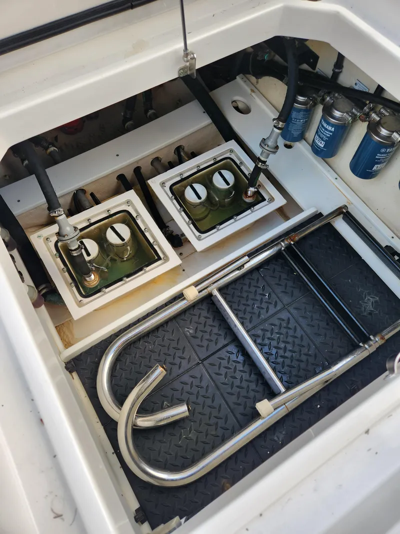 Slide: The Image of Engine compartment of a 2019 HCB 39 Speciale boat, showing fuel filters and metal ladder. - 19