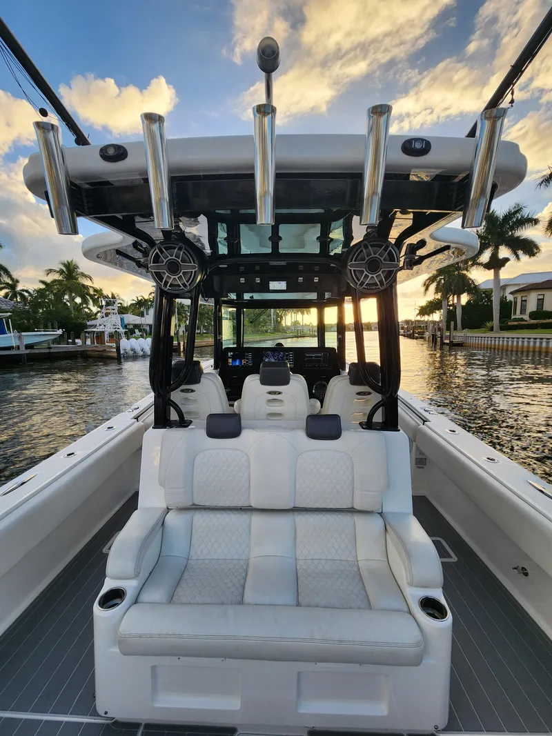 Slide: The Image of 2019 HCB 39 Speciale boat interior with luxurious seating and sunset view on the water. - 26