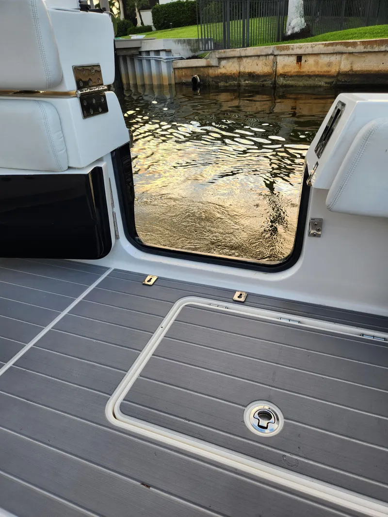 Slide: The Image of 2019 HCB 39 Speciale boat interior with open door, showing water view. - 33