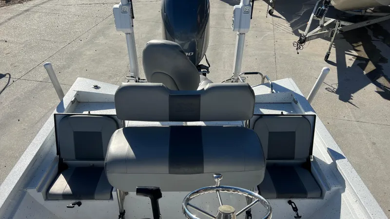 Slide: The Image of 2019 Xpress H24B boat interior with seating and steering wheel. - 10