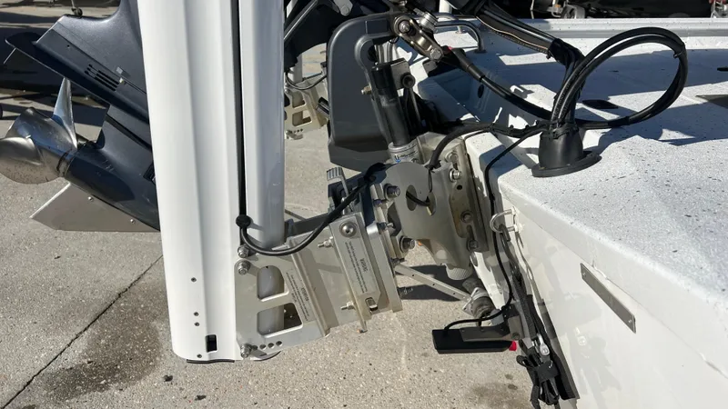 Slide: The Image of Close-up of the 2019 Xpress H24B boat's motor mount and hydraulic system. - 13