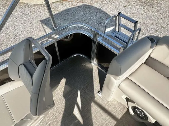 Slide: The Image of 2024 Avalon VTX 19 Cruise pontoon boat interior with seating and entry gate. - 14