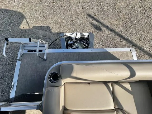 Slide: The Image of 2024 Avalon VTX 19 Cruise pontoon boat interior with seating and ladder. - 15