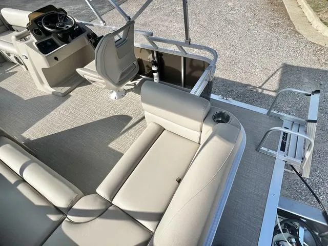 Slide: The Image of 2024 Avalon VTX 19 Cruise pontoon boat interior with seating and helm station. - 17