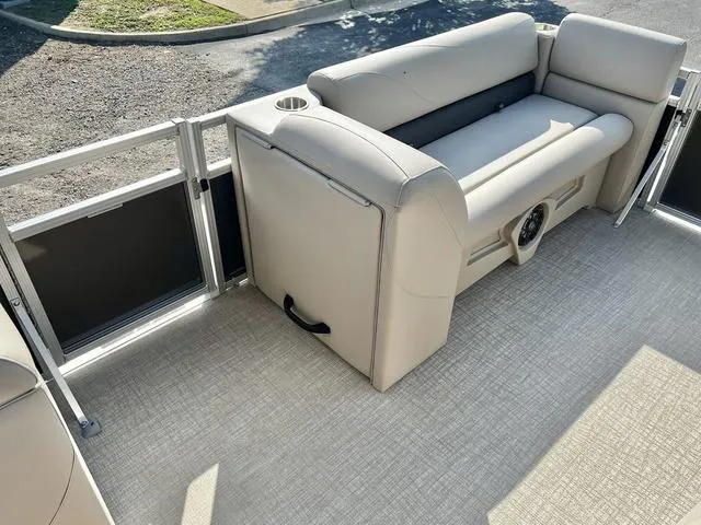 Slide: The Image of 2024 Avalon VTX 19 Cruise pontoon boat interior with beige seating. - 22