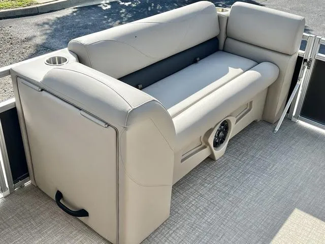 Slide: The Image of 2024 Avalon VTX 19 Cruise boat seating area with cup holders and storage. - 23