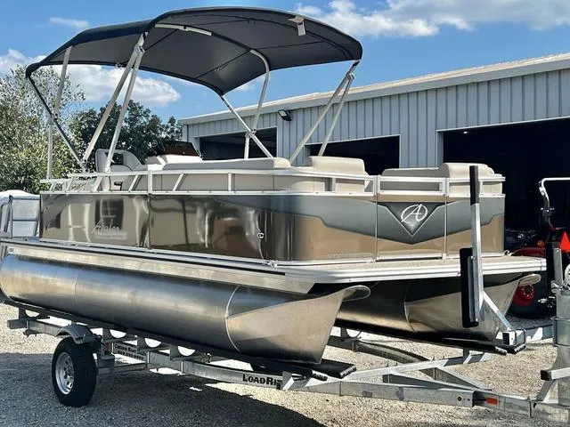 Slide: The Image of 2024 Avalon VTX 19 Cruise pontoon boat on trailer, in stock, outdoor setting. - 7