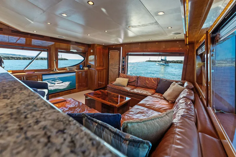 Slide: The Image of Luxurious interior of 2007 Hatteras 64 Convertible yacht with ocean view. - 14