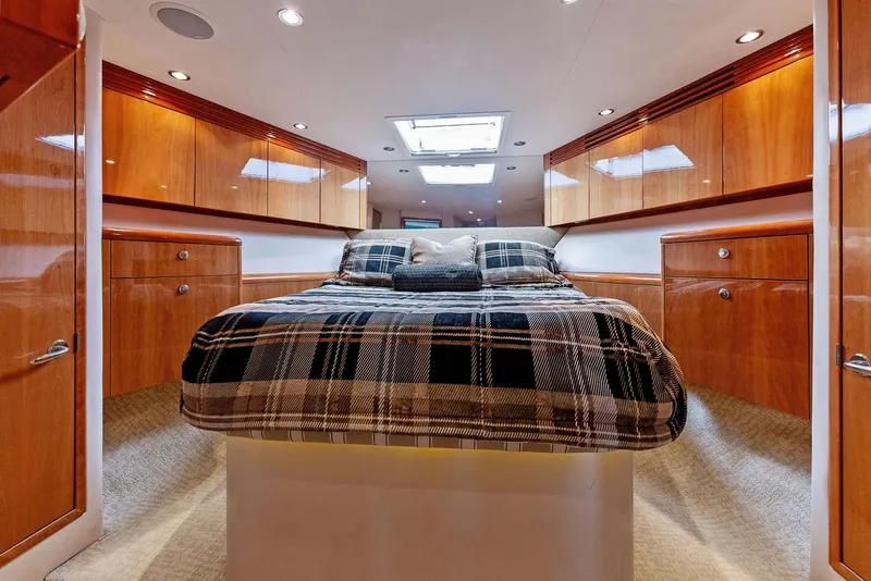 Slide: The Image of Luxurious bedroom interior of 2007 Hatteras 64 Convertible yacht with wood cabinetry. - 16