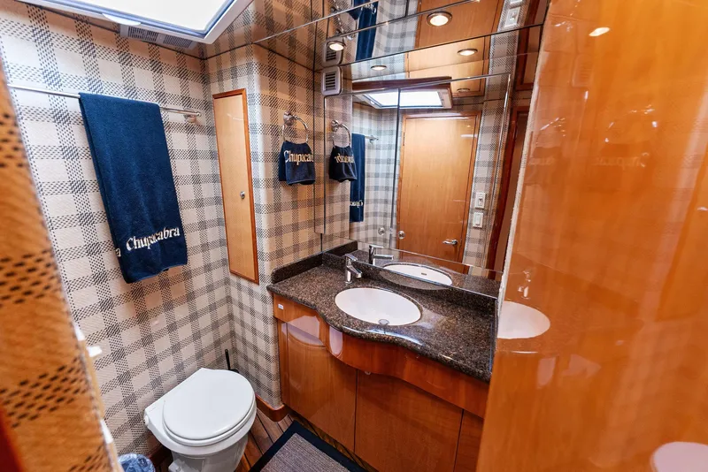 Slide: The Image of Luxurious bathroom in 2007 Hatteras 64 Convertible yacht with modern fixtures and elegant design. - 21